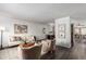 Cozy living room featuring modern furniture, stylish decor, and wood-look floors at 7484 E Princeton Ave, Denver, CO 80237