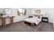 Bedroom with a decorative rug, console table, bench, and a large window at 7484 E Princeton Ave, Denver, CO 80237
