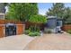 Backyard with built-in grill, privacy fence, and a covered hot tub for relaxation at 26155 E Euclid Dr, Aurora, CO 80016