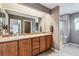 Primary bathroom features a double sink vanity and glass shower at 26155 E Euclid Dr, Aurora, CO 80016