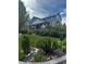 Charming two-story home with lush front yard landscaping and an inviting covered porch at 26155 E Euclid Dr, Aurora, CO 80016