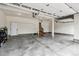 Spacious two car garage with a utility door to access the upper level at 26155 E Euclid Dr, Aurora, CO 80016
