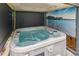 Relaxing hot tub inside a shaded enclosure, offering a serene and private experience at 26155 E Euclid Dr, Aurora, CO 80016