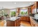 Bright and modern kitchen with an island, stainless steel appliances, and ample storage at 26155 E Euclid Dr, Aurora, CO 80016