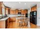 Spacious kitchen with an island, stainless steel appliances, and ample cabinet space at 26155 E Euclid Dr, Aurora, CO 80016