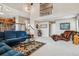 Spacious living room with high ceilings, a ceiling fan, and many windows at 26155 E Euclid Dr, Aurora, CO 80016