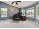 Bright home office featuring a ceiling fan, neutral carpet, lots of natural light, and space for work at 26155 E Euclid Dr, Aurora, CO 80016