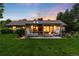 A well-maintained backyard with a covered patio, fire pit, and lush green lawn, ideal for relaxation and outdoor gatherings at 1 Club Ln, Littleton, CO 80123