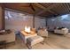 Relaxing outdoor patio featuring a fire pit and comfortable seating in a covered space at 1 Club Ln, Littleton, CO 80123
