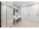 Spacious walk-in closet with built-in vanity, mirror, and ample storage space at 1 Club Ln, Littleton, CO 80123