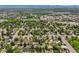 Expansive aerial view of a neighborhood with mature trees and proximity to retail and community ammenities at 5355 S Windermere St, Littleton, CO 80120