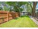 Backyard featuring a lawn, privacy fence, and mature trees at 5355 S Windermere St, Littleton, CO 80120
