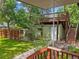 Backyard view of additional structure with deck, lawn, and landscaping at 5355 S Windermere St, Littleton, CO 80120