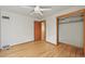Spacious bedroom with hardwood floors, closet, and neutral-colored walls at 5355 S Windermere St, Littleton, CO 80120