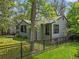 Charming home with a well-maintained lawn and mature trees and shrubs surrounding the property at 5355 S Windermere St, Littleton, CO 80120