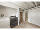 Basement laundry room featuring a washer, dryer, and a water heater, next to a doorway at 5355 S Windermere St, Littleton, CO 80120