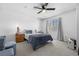 Neutral bedroom featuring a ceiling fan, plush textiles and wooden nightstands at 9877 Arthur Ln, Highlands Ranch, CO 80130