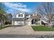 Spacious home with a three-car garage and well-maintained lawn, providing ample parking and curb appeal at 9877 Arthur Ln, Highlands Ranch, CO 80130