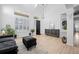 Bright foyer with high ceilings and sleek decor, creating a grand and welcoming entrance to the home at 9877 Arthur Ln, Highlands Ranch, CO 80130