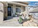 Welcoming front porch with a swing and manicured landscaping, offering a charming curb appeal and relaxation at 9877 Arthur Ln, Highlands Ranch, CO 80130