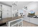 Bright living room featuring an open floor plan, fireplace, high ceilings and a loft area at 9877 Arthur Ln, Highlands Ranch, CO 80130