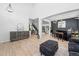 Open-concept living room with high ceilings, natural light, and modern decor, creating a spacious and stylish atmosphere at 9877 Arthur Ln, Highlands Ranch, CO 80130