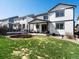 Spacious backyard featuring a well-maintained lawn, trampoline, and patio with outdoor seating, perfect for entertaining at 2853 Black Canyon Way, Castle Rock, CO 80109