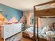 Colorful bedroom with unique wall art, bunk beds, a window and charming decor at 2853 Black Canyon Way, Castle Rock, CO 80109