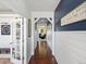 Inviting hallway with rich hardwood floors and stylish decor, leading to various rooms in the house at 2853 Black Canyon Way, Castle Rock, CO 80109