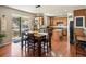 Spacious kitchen with hardwood floors, a central island, and a dining area at 2853 Black Canyon Way, Castle Rock, CO 80109