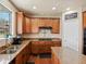 Modern kitchen boasts granite countertops, updated appliances, hardwood floors, and a kitchen island at 2853 Black Canyon Way, Castle Rock, CO 80109
