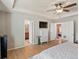 Spacious main bedroom boasts a tv, hardwood floors, ensuite bathroom and direct access to another room at 2853 Black Canyon Way, Castle Rock, CO 80109