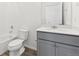 Bright bathroom features a shower-tub combo, gray cabinets, and a white countertop at 6910 Merseyside Ln, Castle Pines, CO 80108