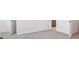 Spacious bedroom featuring two entry doors and neutral carpet flooring at 6910 Merseyside Ln, Castle Pines, CO 80108