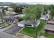 Charming home with lush green lawn, mature trees, and mountain views at 14185 W 50Th Ave, Golden, CO 80403