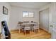 Cozy bedroom featuring wood floors, a window, a closet, and a desk area perfect for a home office at 14185 W 50Th Ave, Golden, CO 80403