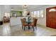 Inviting dining area with seating for four near a modern kitchen, perfect for Gathering meals and entertaining at 14185 W 50Th Ave, Golden, CO 80403