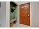 Welcoming entryway featuring a closet and a charming wooden door at 14185 W 50Th Ave, Golden, CO 80403