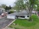 Charming single-story home with a two-car garage, front porch, and spacious, tree-lined backyard at 14185 W 50Th Ave, Golden, CO 80403