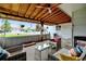 Inviting covered patio with comfortable seating, perfect for outdoor entertaining at 14185 W 50Th Ave, Golden, CO 80403