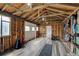 Spacious workout room features exposed beams, updated floor and various fitness equipment at 14185 W 50Th Ave, Golden, CO 80403