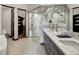 Elegant bathroom with double vanity and walk-in shower at 52 West Point Lode # A, Breckenridge, CO 80424
