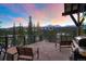 Deck with mountain views, chairs, and grill at 52 West Point Lode # A, Breckenridge, CO 80424