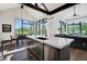 Modern kitchen with island, stainless steel appliances, and mountain views at 52 West Point Lode # A, Breckenridge, CO 80424