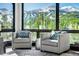 Relaxing living room with mountain views and comfy armchairs at 52 West Point Lode # A, Breckenridge, CO 80424