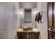 Modern powder room with unique stone sink and wood vanity at 52 West Point Lode # A, Breckenridge, CO 80424