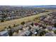 Aerial view of a residential neighborhood showcasing a network of streets, and many single-Gathering homes at 294 Willowick Cir, Highlands Ranch, CO 80129