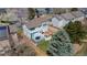 Aerial view of a two-story home with a wooden fence surrounding the backyard with a patio dining set at 294 Willowick Cir, Highlands Ranch, CO 80129