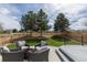 Backyard patio space with outdoor seating and landscaping at 294 Willowick Cir, Highlands Ranch, CO 80129