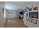 Spacious finished basement with wood flooring and wall decor at 294 Willowick Cir, Highlands Ranch, CO 80129
